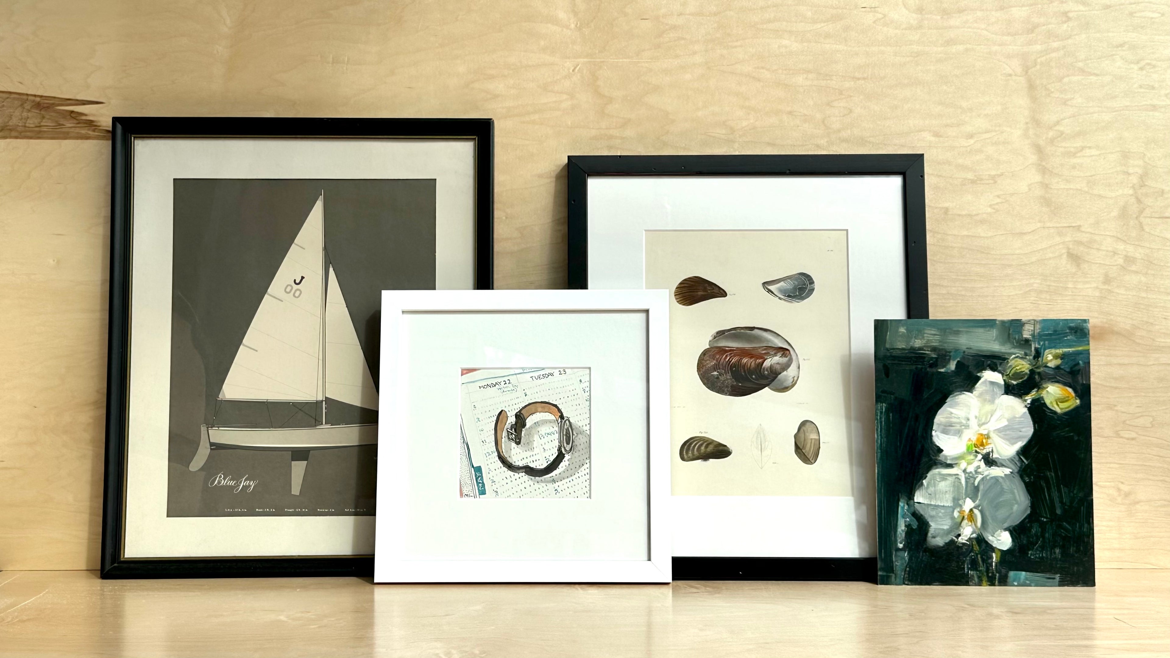 Grouping of artwork including print of sailboat, watercolor of watch, print of shells, oil painting of orchid