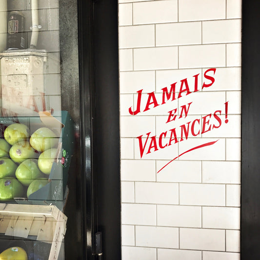 Jamais en Vacances! rue de Charenton, Paris 2017 by John Lawler