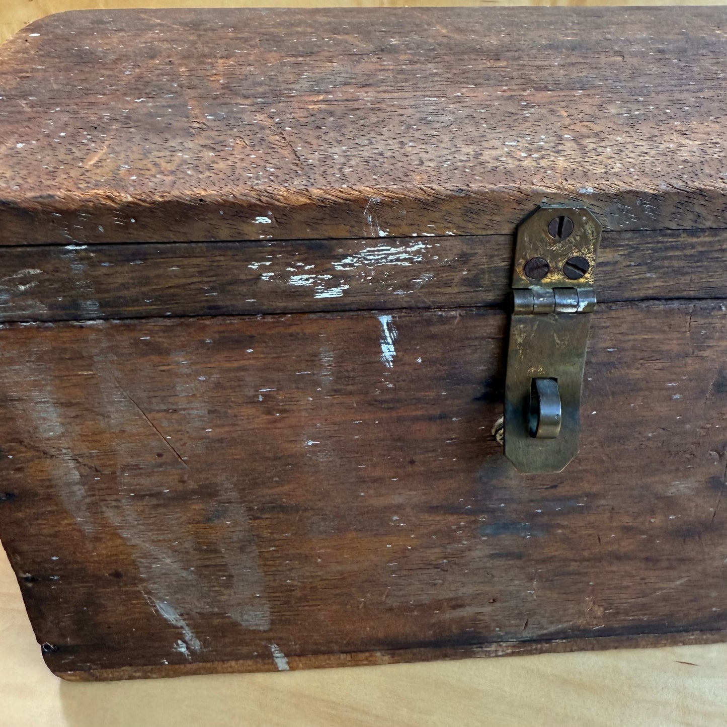 Wooden box with hinged lid and clasp